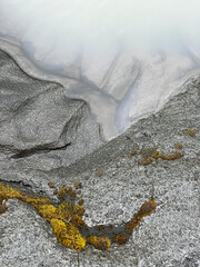 Sand and stone eroded by a glacial river in Iceland