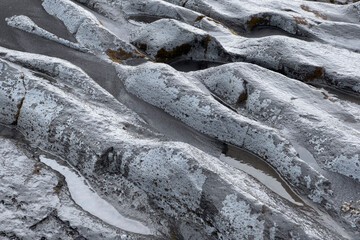 Rocks eroded by a glacial river in Iceland