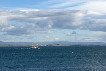 A whaling boat sailing out to sea in Iceland.