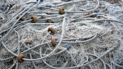 white fishing net with buoys