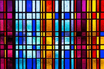 Photo sur Plexiglas Coloré Colorful stained glass window in modern design with blue, red, violet and yellow pieces of glass