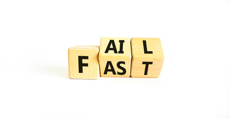 Fail fast symbol. Concept words Fail fast on wooden cubes. Beautiful white table white background....