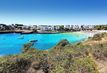 Fototapeta na wymiar A view of beautiful beach Cala Marcal in Portocolom resort, Mallorca, Spain.