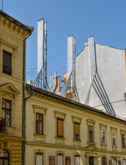 Fototapeta na wymiar Streets corner in Budapest with roof chimneys clusters, Hungary.