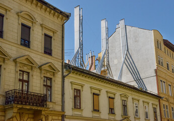 Fototapeta na wymiar Streets corner in Budapest with roof chimneys clusters, Hungary.