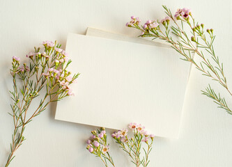 blank white invitation template, rectangle, art canvas texture, soft shadows, flower decoration, white background, canvas texture, photo taken from above