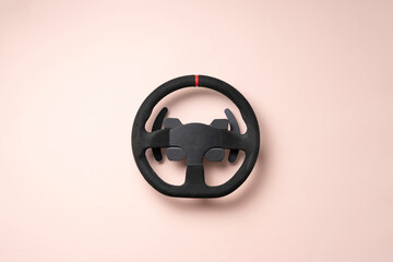 isolated car steering wheel on the flat surface, simple transportation concept