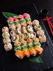 tasty sushi on the black background