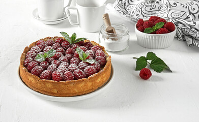 Raspberry homemade cake on table on sunny summer morning, selective focus, breakfast concept