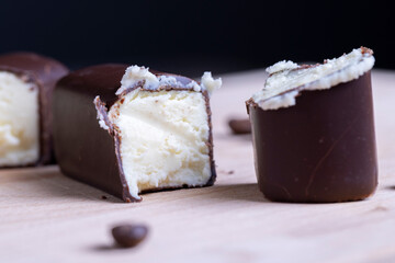 Chilled cottage cheese with sugar in chocolate