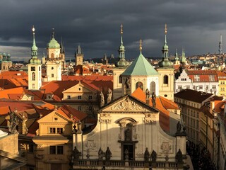 dark skies and sunshine above the old town