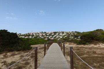 Obraz premium Son Bou, Menorca, Spain. View of the village from the salt marshes