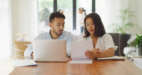 Worried, stressed married couple discussing online banking payment of financial budget on their loan mortgage bills of their family home. Frustrated husband and wife filing tax utility together - Powered by Adobe