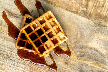 square sweet soft waffles in bee honey