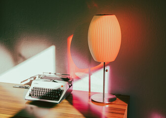 Typewriter and lamp on desk
