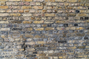 Closeup evenly brick wall different colored background