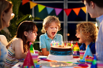 Child birthday party cake. Family with kids.