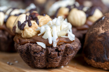 multicomponent cake made of caramel and nuts in chocolate