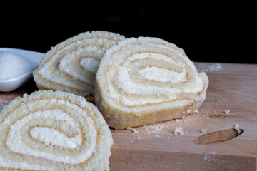 a rolled roll of soft cake and sweet curd filling