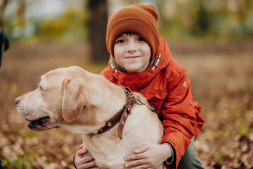 Friendship of a child with a dog. Raising children with love for animals and humanism.