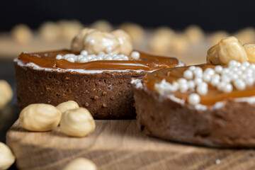 chocolate tartlet with cream filling and salted caramel with nuts