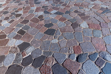 A road paved with made of stones and cobblestones for vacationing people