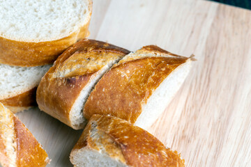 sliced into pieces a long baguette with a crispy crust