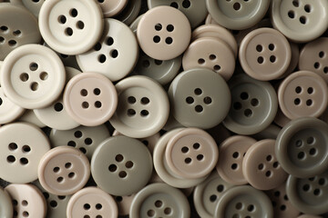 Many plastic sewing buttons as background, closeup