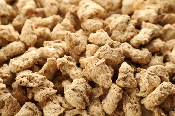 Dehydrated soy meat chunks as background, closeup