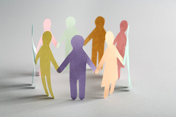 Paper human figures making circle on white background. Diversity and Inclusion concept - obrazy, fototapety, plakaty