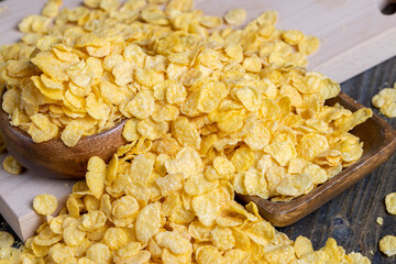 dry breakfast corn flakes of yellow color , close up