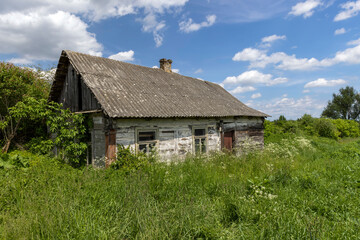Fototapeta na wymiar An old abandoned wooden house