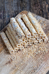waffle tube with chocolate filling and crushed peanuts
