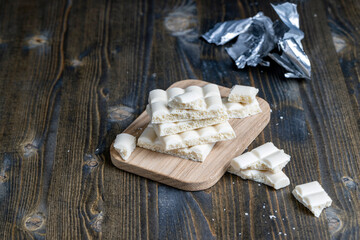 a white chocolate bar broken into pieces