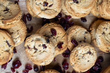 delicious dried cookies made of high-quality flour with dried red cranberries on the table