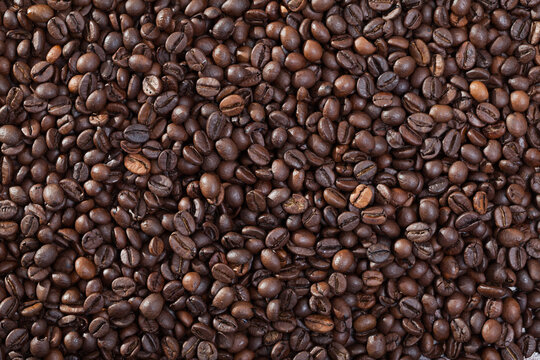 Roasted coffee beans background. High quality photo © JackF