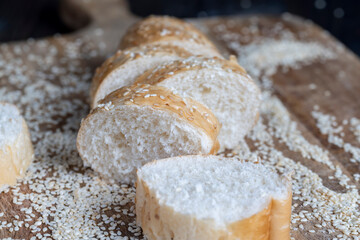wheat grain baguette sprinkled with sesame seeds