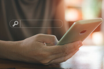 Close up of people hand using mobile phone or smartphone searching for information in internet...
