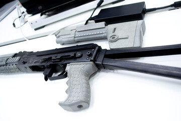 Detail of a weapon printed on a 3D printer. A weapon detail printed on a 3D printer from powder on the table