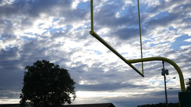Establishing Shot of Football Goal Post with Morning Cloud Backdrop