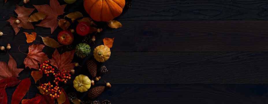 Fall flat lay with leaves, Pumpkins and Fruits. Thanksgiving concept with space for text.