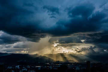 Smog contamination pollution in the mountains of the city of medellin colombia antioquia red and dirt