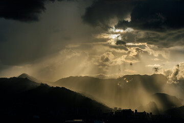 Smog contamination pollution in the mountains of the city of medellin colombia antioquia red and dirt