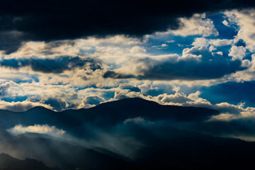 Fototapeta na wymiar clouds over the mountains of medellin antioquia colombia
