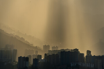 Smog contamination pollution in the mountains of the city of medellin colombia antioquia red and dirt