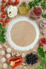 set of ingredients for making homemade pizza. Fresh cherry tomatoes and mushrooms, dough flour, mozzarella, olive oil and herbs, top view, copy space for your text