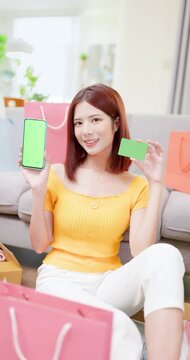 woman with green screen mobile