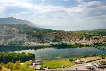 Picturesque view of the valley of the Buna River flowing into the Skadar lake near the city of Shkodra, Albania, seen from the Rosafa Fortress. Travel and tourism