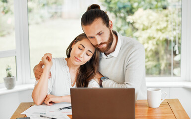 Support, couple and finances while embracing each other and sitting with papers and a laptop for bill payments and looking worried in a tough economy. Husband and wife having financial difficulties