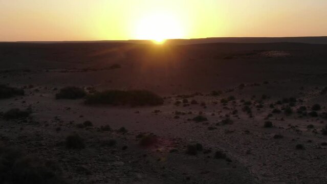 Sunset or sunrise over Morocco Erfoud desert in the Saharan Tafilalet region. Aerial drone view